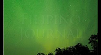 Northern Lights dance across the night sky