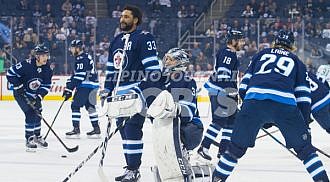 Jets defeat Wild in 5